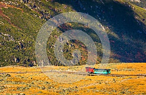 View of a train on the Mount Washington Cog Railway from the sum