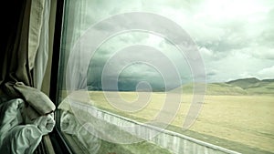 View from a train moving on the Tibetan plateau.