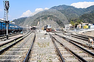 View of train Railway Tracks from the middle during daytime at Kathgodam railway station in India, Train railway track view,