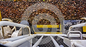 View of train track from the boarding platform of a speeding locomotive