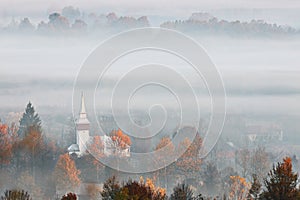 View of transylvanian village in the fog