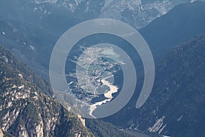 View from Tre Cime peaks dolomites into the valley into the village Auronzo di Cadore Italy