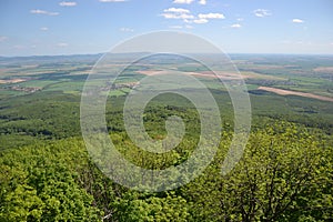 View of trees, mountains, hills, fields and villages