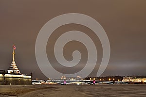 View of Troitsky bridge from Peter and Paul fortress winter nigh