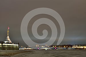 View of Troitsky bridge from Peter and Paul fortress winter nigh