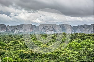 View of a tropical landscape, with forest and mountains Pungo Andongo, Pedras Negras , black stones, huge geologic rock elements photo