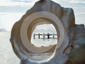 View through a tropical sea shell on the beach