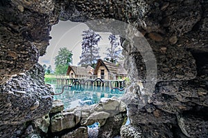 View trough a cave hole to the old straw houses in bally park sc