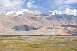 View of Tso Moriri lake in Ladakh in Himalayas with high peaks photo