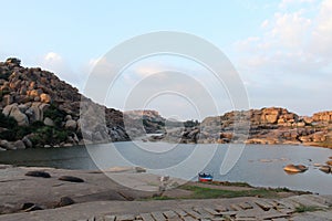 View of Tungabhadra river and stone hills, Hampi, Karnataka