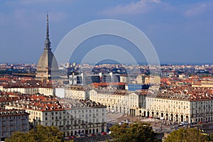 The view of Turin,Italy with  the symbol  monument the Mole Antonelliana  and the square Vittorio Veneto with arched porticoes  