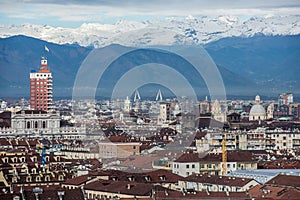 View of Turin with Torre Littoria and snowcapped Alps