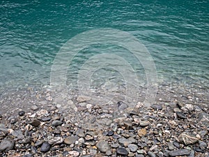 View of turquoise blue creek and foggy mountains