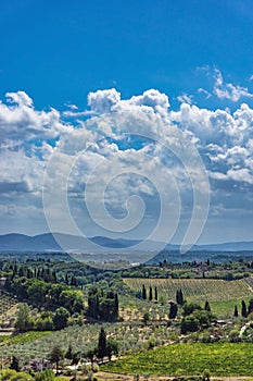 View into Tuscany countryside with clouds in background