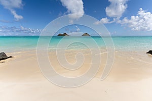 View of the twin islands of Na Mokulua from Lanikai Beach in Kailua, Hawaii, USA