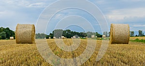 A view through two bales and in few of them in the background