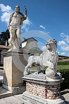 View of two statues in the garden of Villa Barbaro, Italy photo