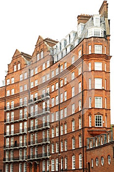 View of typical English building in old red bricks, London