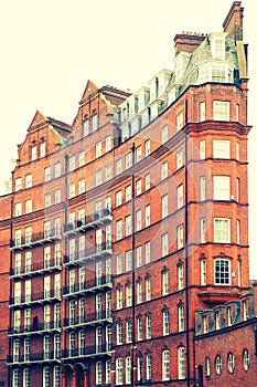 View of typical English building in old red bricks, London