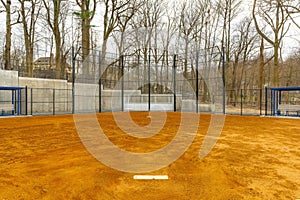 View of typical nondescript high school softball clay infield looking from pitching rubber