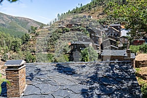 View of a typical schist roof house and PiodÃ£o traditional schist village on mountains as background