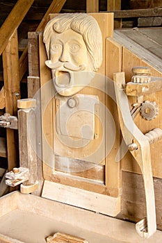 view of a Tyrolean water mill with wood carvings