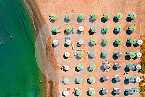 View of umbrellas and people relaxing and bathing at Alaminos beach. Larnaca District, Cyprus