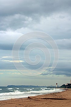 VIEW OF UMHLANGA LIGHTHOUSE AND PIER ALONGSIDE THE INDIAN OCEAN