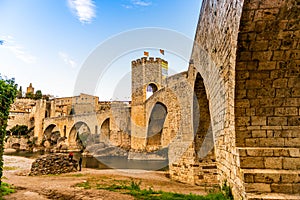 View under the beautiful medieval bridge in Besalu, Catalonia, Spain