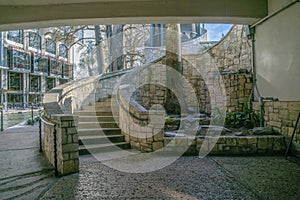 View from under a bridge of an outdoor staircase in San Antonio River Walk Texas