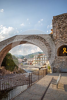 View under the bridge of river houses in Camprodon. photo