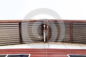 View under Galvanized roof of home structure large made with plate galvanized sheet attached on of wooden house.