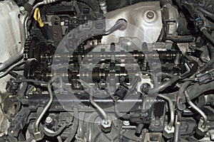 View under the hood of the camshafts of a diesel engine with the valve cover removed