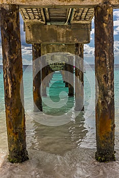 A view under a jetty on Carlisle beach in Bridgetown, Barbados