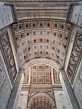 View underneath triumphal Arch in Paris, France. Arc de triomphe, famous historic landmark architecture details