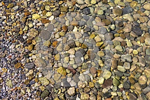 View of underwater pebbles in the sea, pebble background