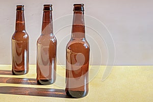 View unlabelled bottles of beer with their shades on the table