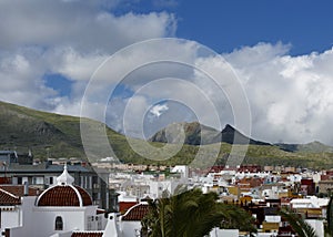 View of unspoiled mountains from the roofs of houses in Spain