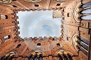 View up from Cortile del Podesta, Courtyard of Palazzo Pubblico in Siena. Italy