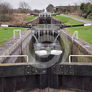 View up the flight of Caen Hill locks from the bottom lock gate on the Kennet and Avon canal, Devizes, Wiltshire