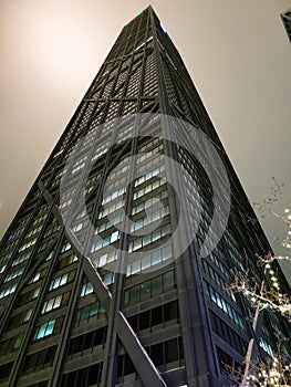 A view up on John Hancock building in downtown Chicago at night