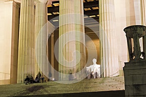 View up the Lincoln Memorial steps towards the illuminated Central Chamber, National Mall, Washington DC