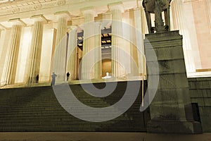 View up the lower and upper steps of the Lincoln Memorial towards the illuminated Central Chamber, National Mall, Washington DC