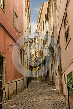 A view up a narrow alley in the Alfama distict in the city of Lisbon