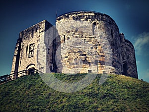 View up the steps on the motte to the ruins of the stone medieval Norman keep of York Castle known as Cliffords Tower 