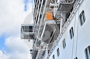 View up to the bridge and the rescue boats of a large cruise ship