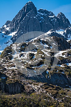 View up the wall from the water of Trollfjord