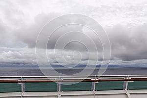 View from upper deck of modern cruise ship on a grey stormy day in the Tropics