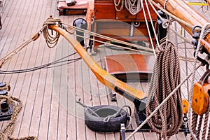 View on upper deck of sail ship with tiller at daylight.