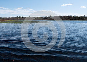 View of Upper Mason Pond in Belfast Maine from the center of the pond in early morning light